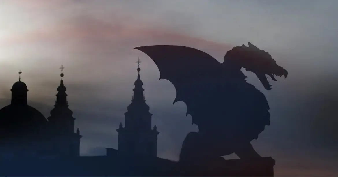 Silhouette of a dragon with wings spread, set against a misty sky with the outlines of church spires in the background.